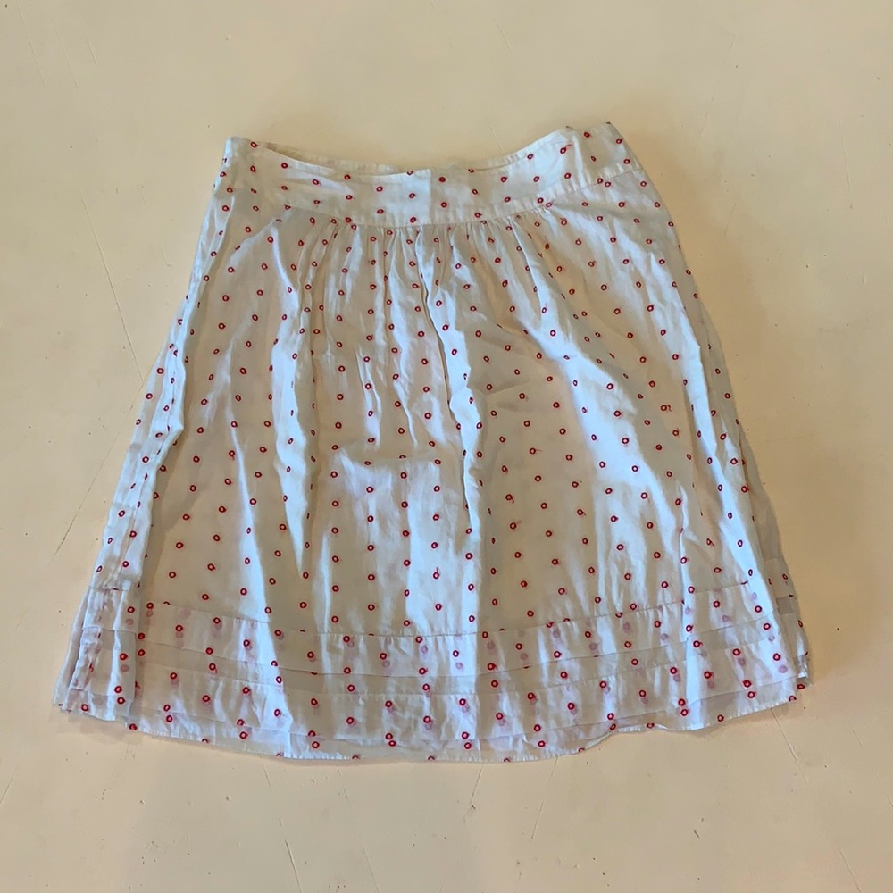 White with red “O” spots, skirt